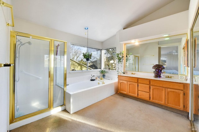 ensuite bathroom featuring a stall shower, lofted ceiling, carpet flooring, vanity, and a bath