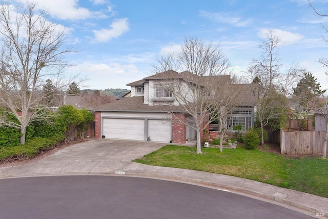 view of front facade featuring brick siding, concrete driveway, a front yard, fence, and a garage