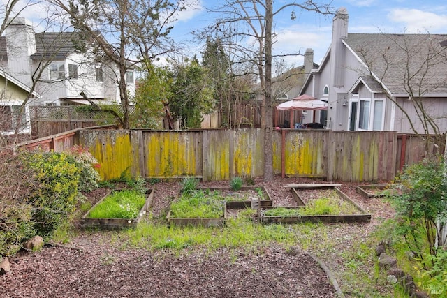 view of yard featuring a garden and fence