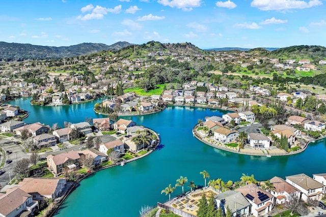 aerial view featuring a residential view and a water and mountain view