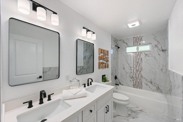 full bath featuring washtub / shower combination, marble finish floor, a sink, and toilet