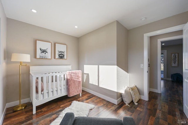 bedroom featuring hardwood / wood-style flooring, baseboards, and recessed lighting