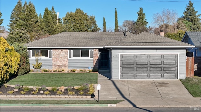 ranch-style house with a garage, brick siding, concrete driveway, roof with shingles, and a front yard