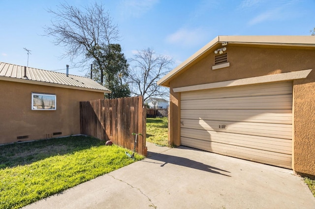 exterior space featuring stucco siding, crawl space, fence, a garage, and driveway