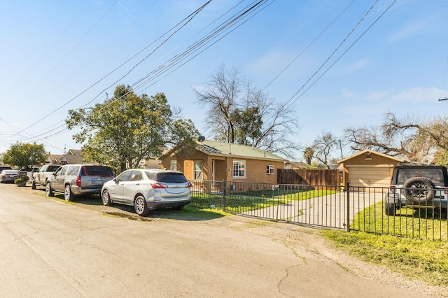 ranch-style house with a fenced front yard and a front yard