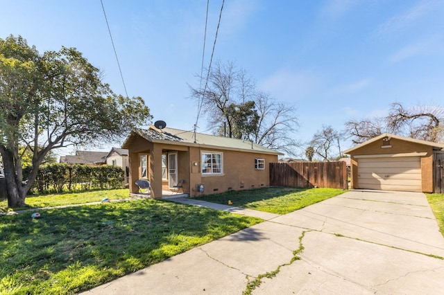 view of front of house with a garage, a front yard, fence, and stucco siding