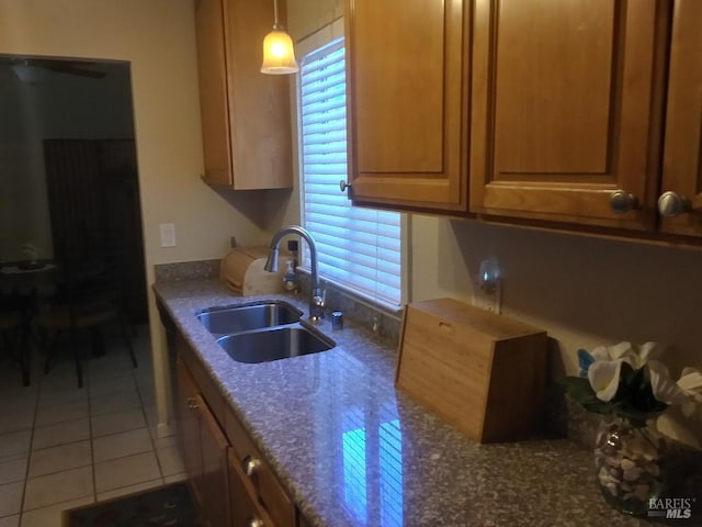808 Pochard Way, Suisun City, CA 94585 - kitchen featuring a sink, tile patterned floors, dark stone countertops, and pendant lighting
