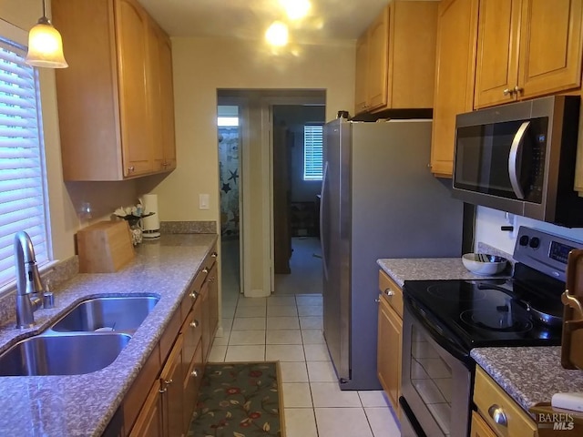 808 Pochard Way, Suisun City, CA 94585 - kitchen with stainless steel appliances, a sink, light tile patterned floors, stone counters, and decorative light fixtures