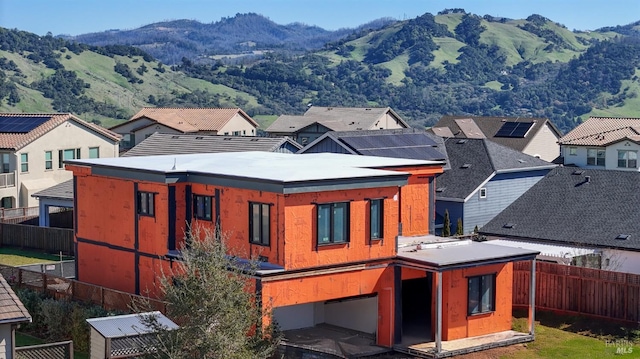 exterior space featuring fence private yard and a mountain view