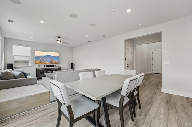 dining room with baseboards, visible vents, a ceiling fan, light wood-type flooring, and recessed lighting