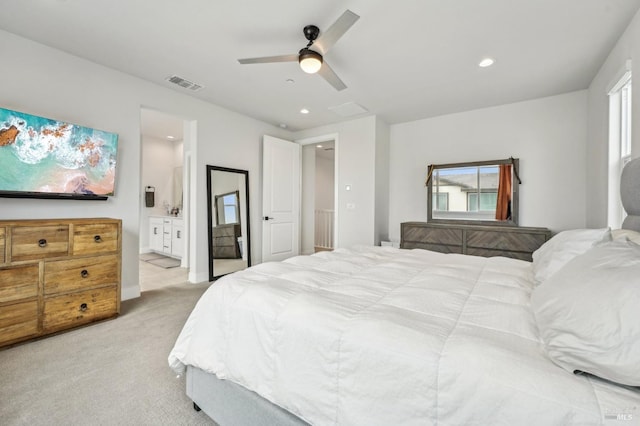 bedroom featuring recessed lighting, light colored carpet, visible vents, ensuite bathroom, and a ceiling fan