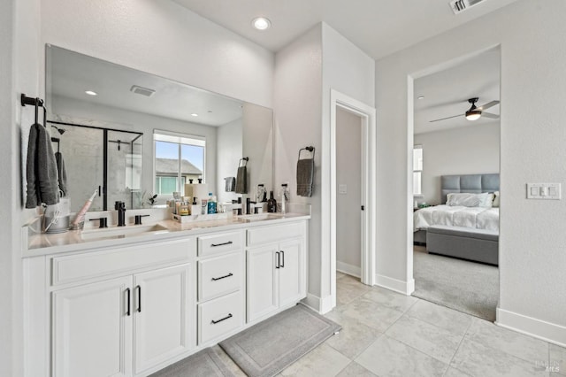 full bathroom featuring ensuite bathroom, a sink, visible vents, a shower stall, and double vanity