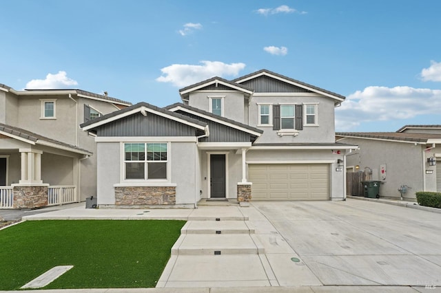 craftsman-style house featuring an attached garage, driveway, stone siding, stucco siding, and a front yard