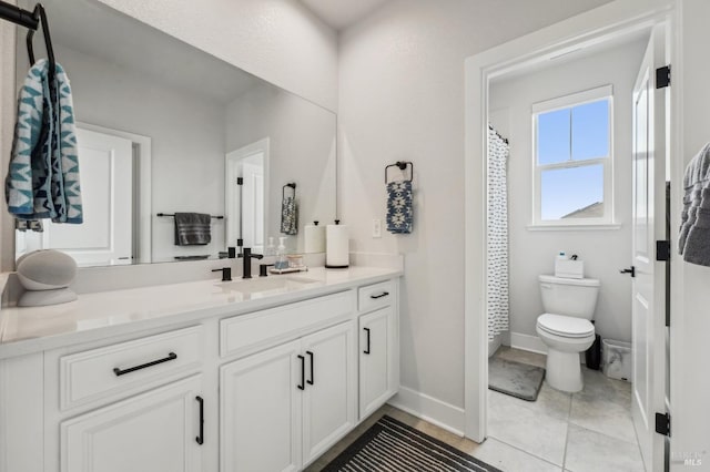 full bath with baseboards, a shower with shower curtain, toilet, tile patterned flooring, and vanity