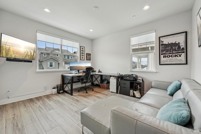 office area with baseboards, wood finished floors, and recessed lighting