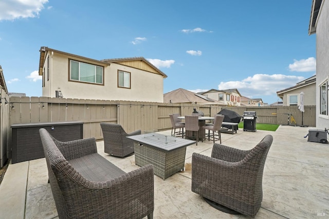 view of patio / terrace featuring outdoor dining area, a fenced backyard, a grill, and an outdoor living space