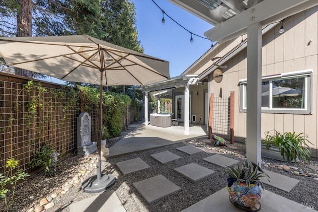 view of patio / terrace with cooling unit and a fenced backyard