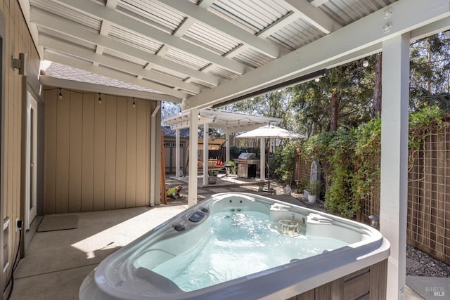 exterior space with a fenced backyard and a hot tub