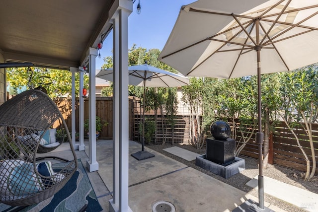 view of patio / terrace featuring fence