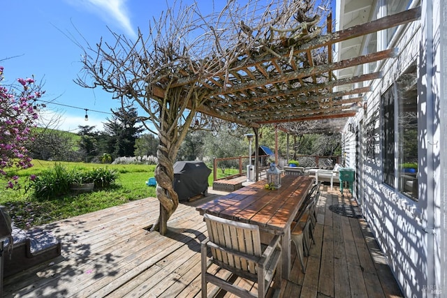 wooden terrace featuring a grill and a pergola