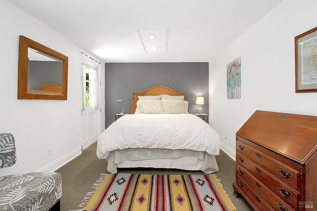 bedroom featuring carpet and baseboards