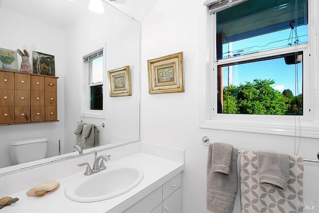 bathroom with vanity and toilet