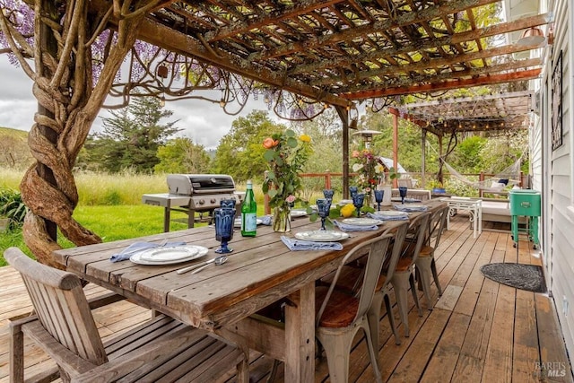 deck with outdoor dining area, a grill, and a pergola