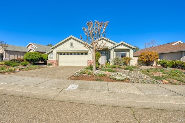 view of front facade with concrete driveway and an attached garage