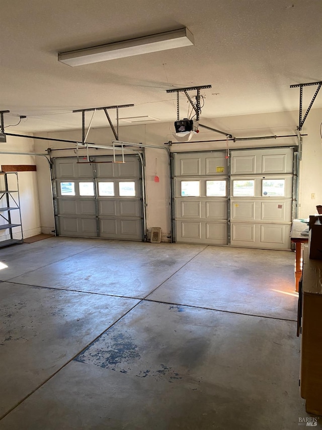 garage featuring a garage door opener