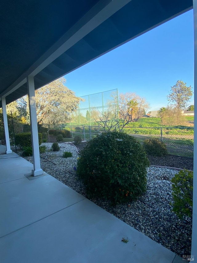 view of patio / terrace featuring fence