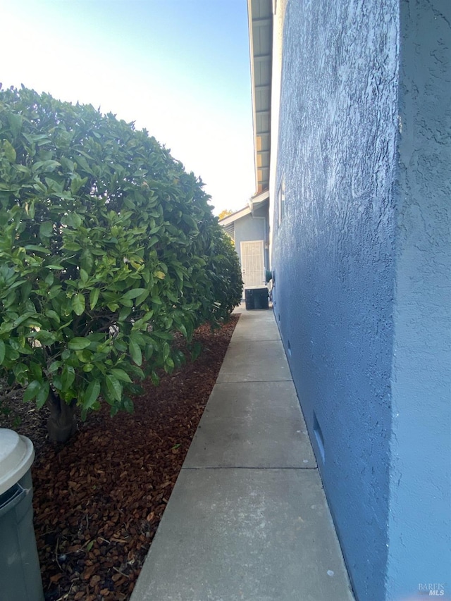 view of side of property featuring stucco siding