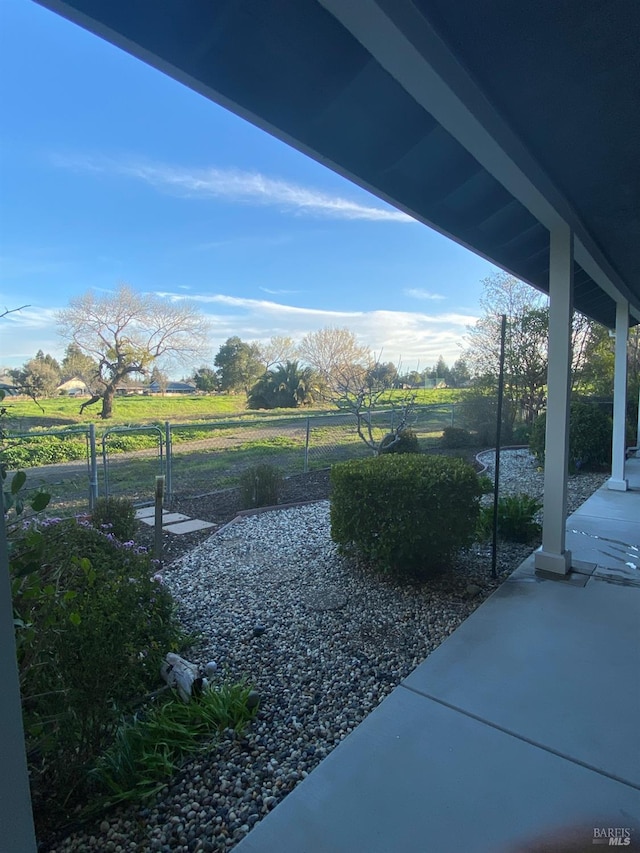 view of yard featuring a patio area and fence