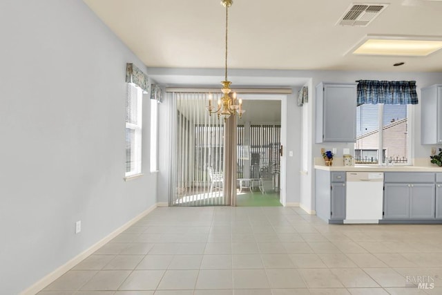 kitchen with light tile patterned floors, a chandelier, gray cabinetry, visible vents, and dishwasher