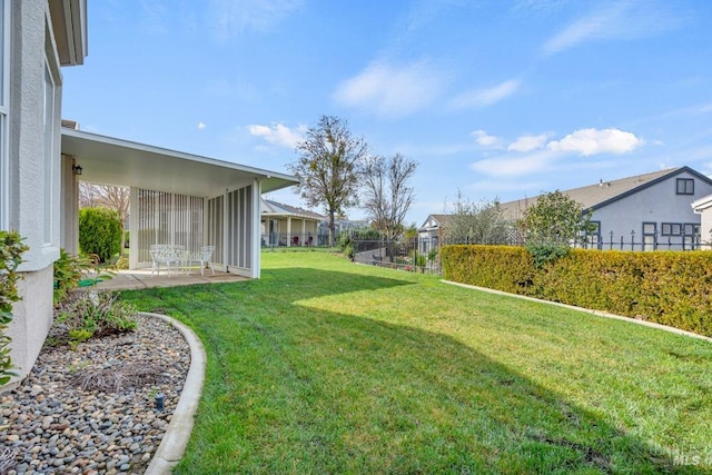 view of yard featuring a patio area and fence