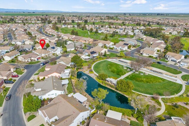 birds eye view of property featuring a residential view and a water view