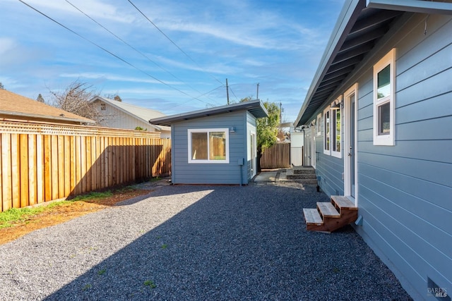 exterior space featuring a fenced backyard and entry steps