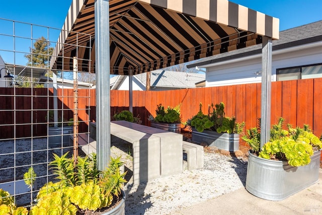 view of patio featuring fence