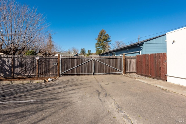 view of gate with fence