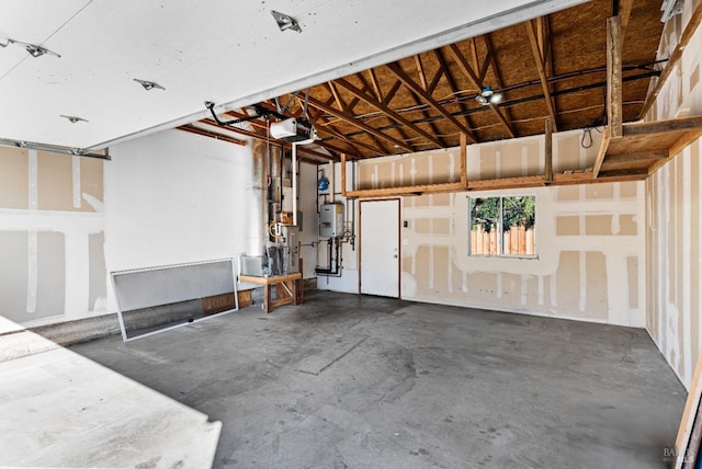 garage featuring water heater and a garage door opener