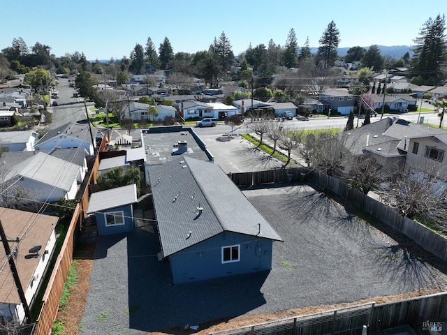 birds eye view of property with a residential view