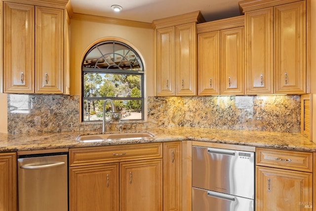 kitchen featuring light stone counters, a sink, backsplash, dishwasher, and crown molding