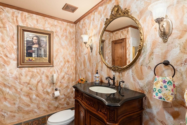 bathroom with toilet, wallpapered walls, visible vents, and ornamental molding