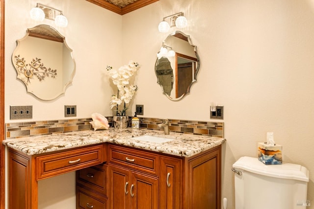 half bath featuring decorative backsplash, vanity, and toilet