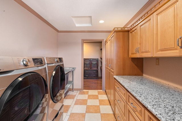 laundry room featuring recessed lighting, separate washer and dryer, ornamental molding, cabinet space, and light floors