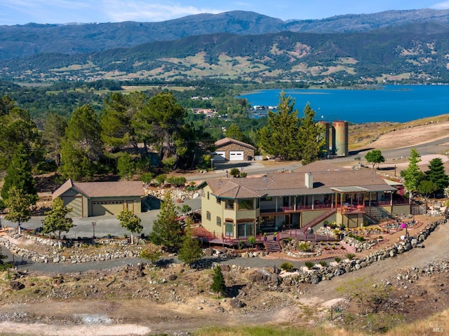 bird's eye view with a water and mountain view