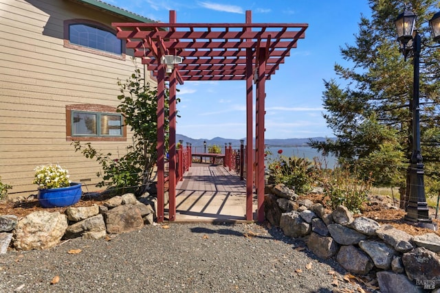 exterior space with a mountain view and a pergola