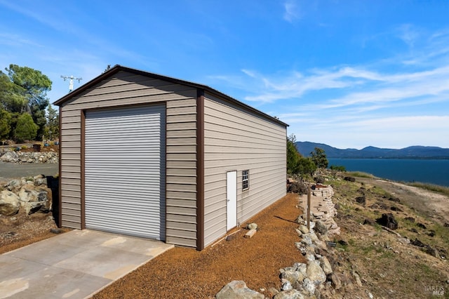 view of outbuilding with a mountain view and an outbuilding