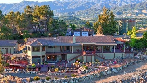 view of front of house with stairs and a mountain view