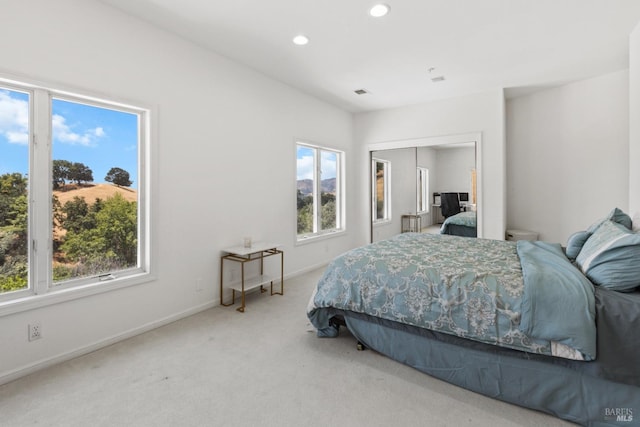 bedroom featuring baseboards, visible vents, carpet flooring, a closet, and recessed lighting