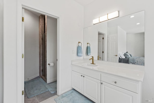 bathroom featuring a shower, recessed lighting, ensuite bathroom, vanity, and tile patterned flooring